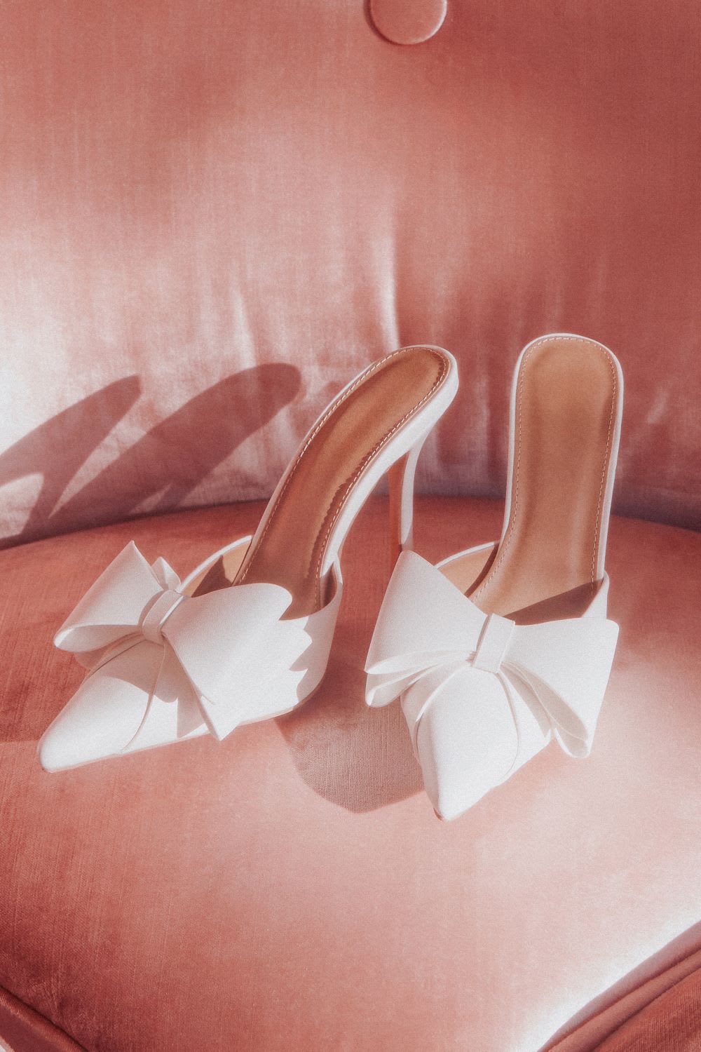 white bow pointed toe mule pumps